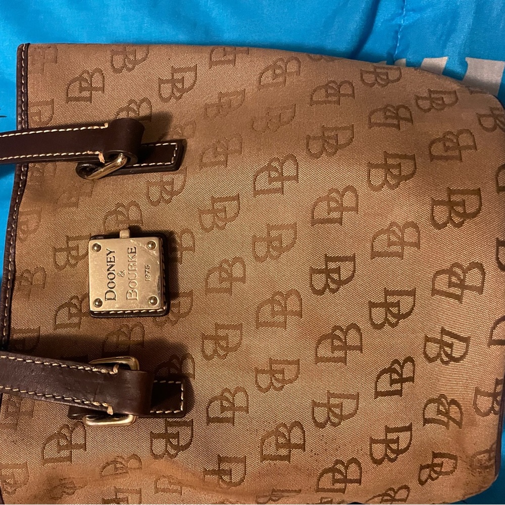 Used with wear Dooney & Burke Bucket style purse
